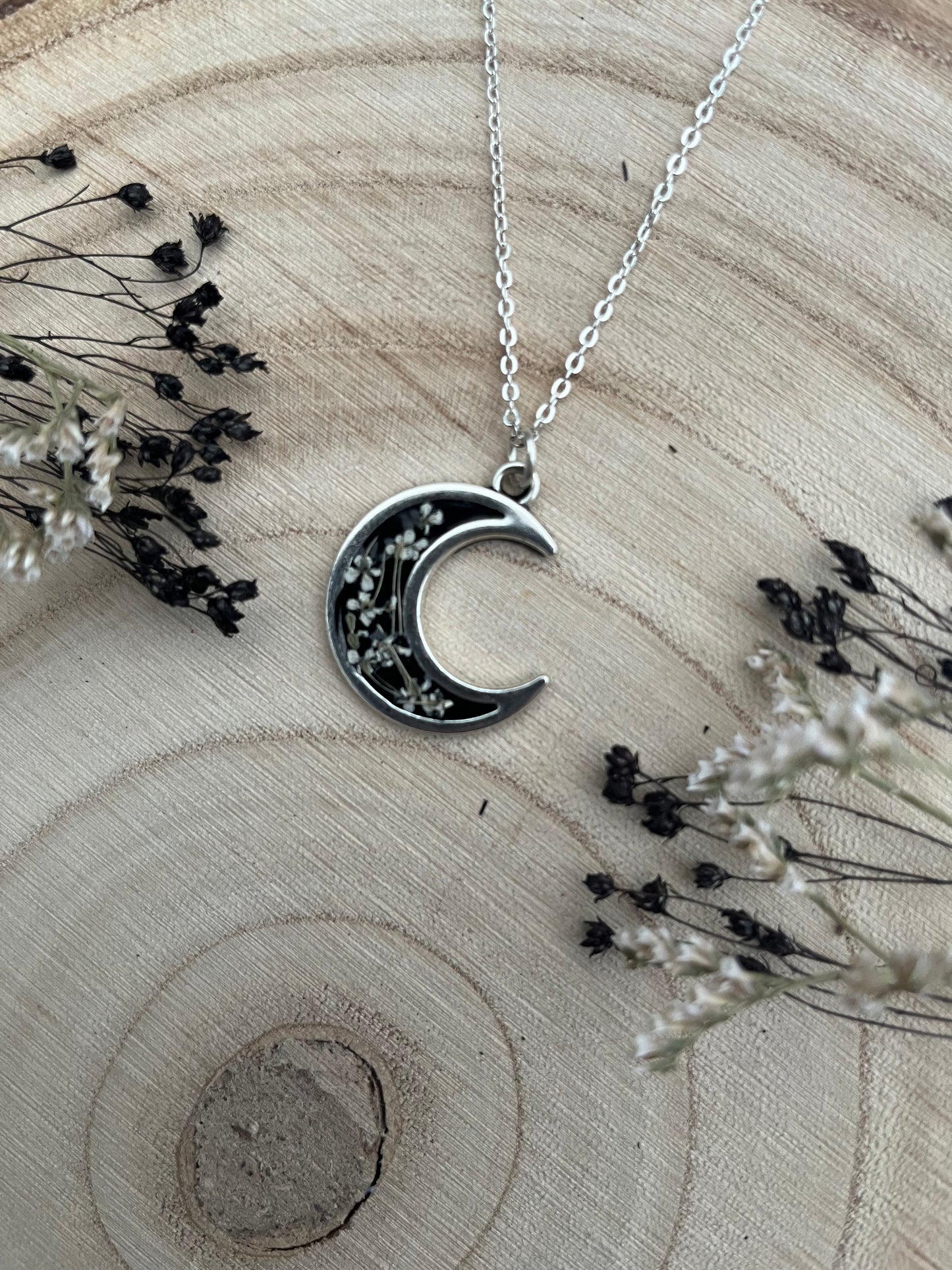 Black Crescent Moon Pendant, filled with flowers