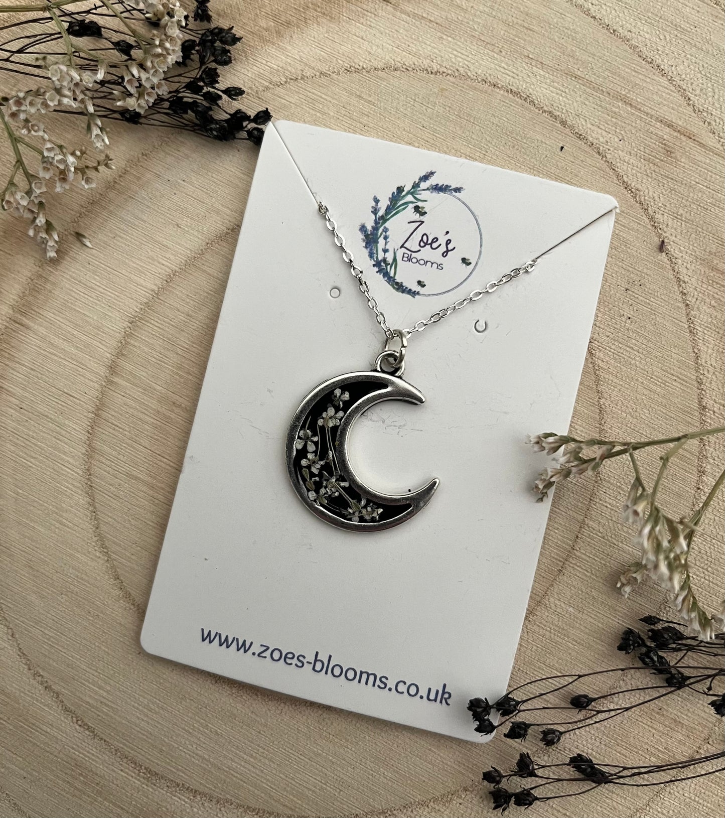 Black Crescent Moon Pendant, filled with flowers