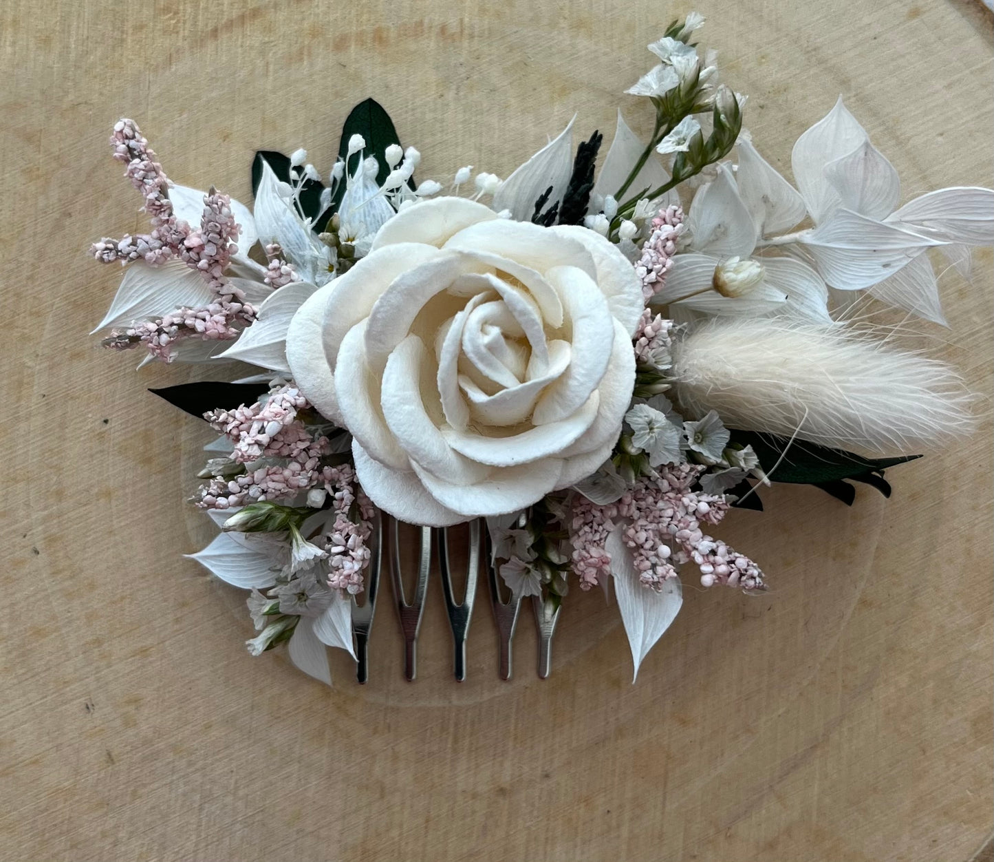 Dried Flower Hair Comb in shades of pink and white.