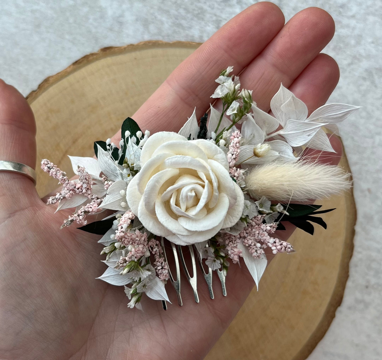 Dried Flower Hair Comb in shades of pink and white.