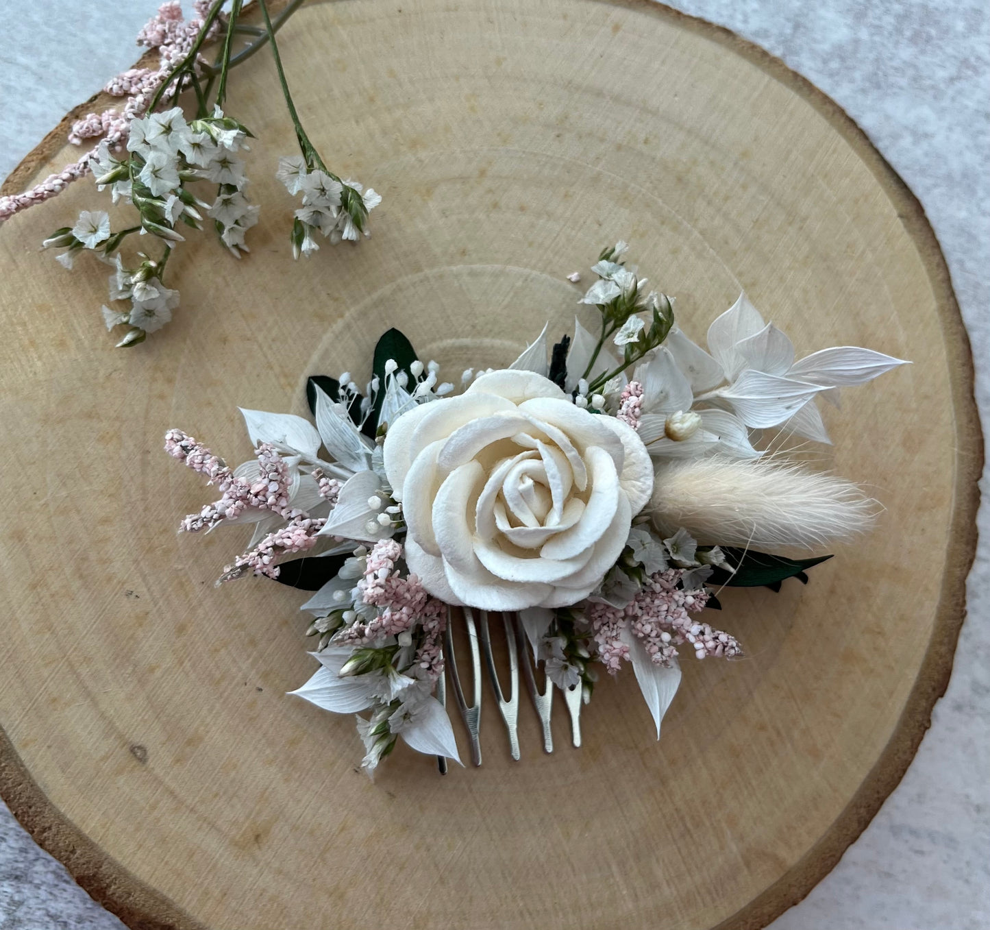 Dried Flower Hair Comb in shades of pink and white.