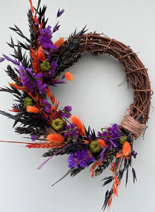 Dried flower Halloween wreath with pumpkins 