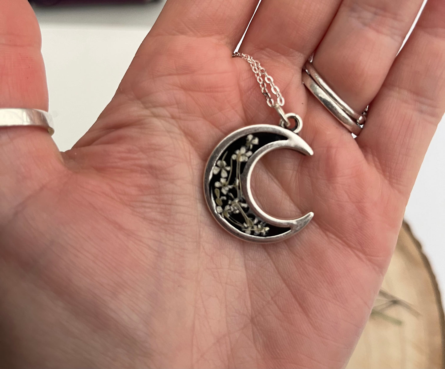 Black Crescent Moon Pendant, filled with flowers