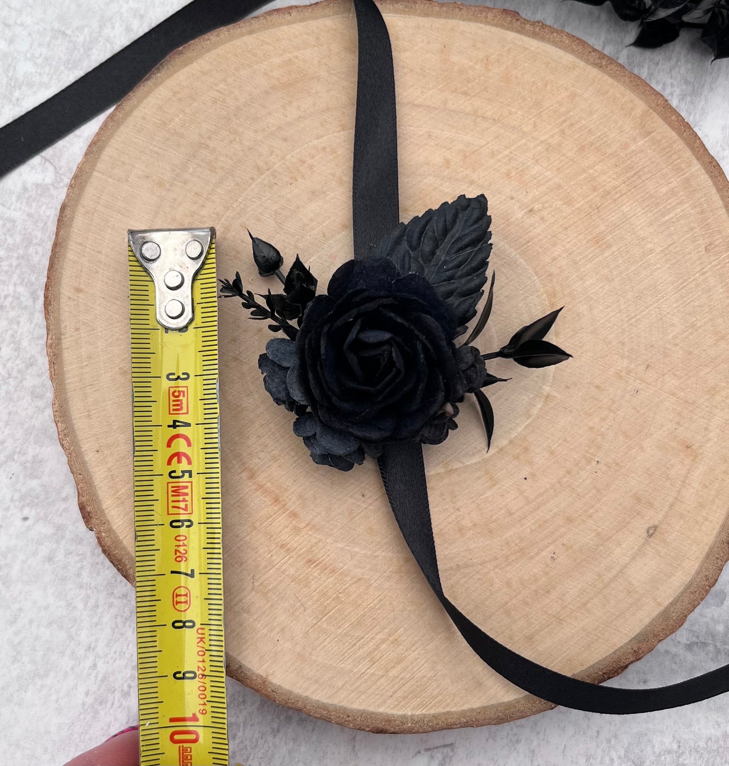Black flower wrist corsage - for weddings and proms.