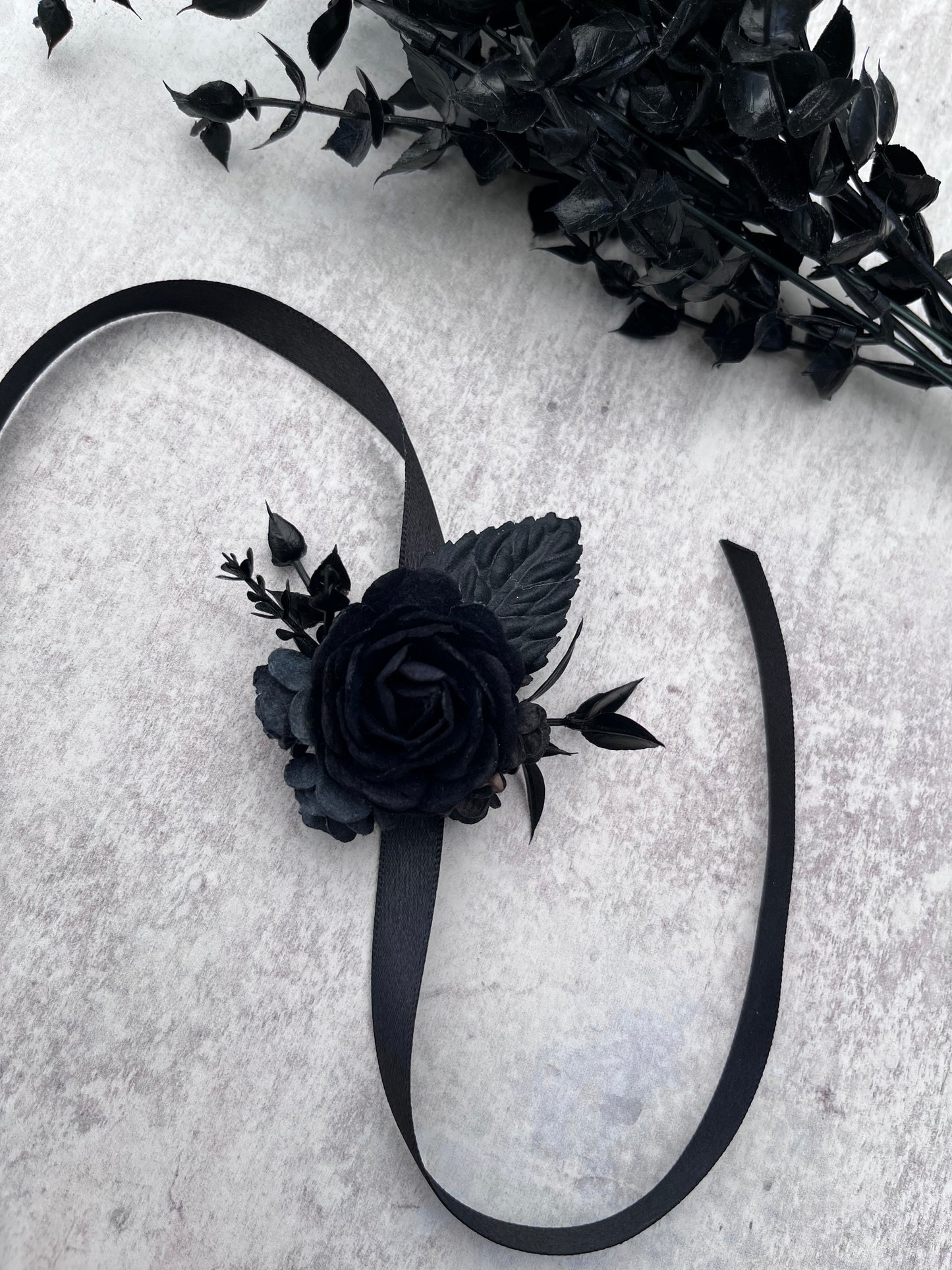 Black flower wrist corsage - for weddings and proms.